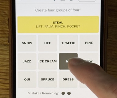 Playing NYT Connections on a phone — sorting words into four color-coded groups