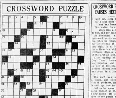 1920s newspaper crossword puzzle alongside an article about crossword mania